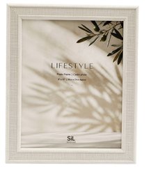 Elegantly frame your treasured memories with this classic white photo frame.