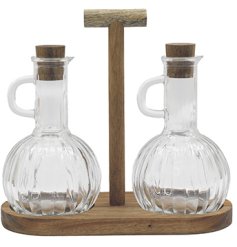 Chic oil and vinegar set with a natural acacia wood tray, perfect for adding charm to your dining table