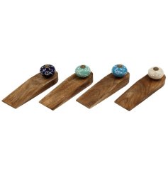Charming fish-shaped doorstop crafted from warm Mango wood for a coastal touch.