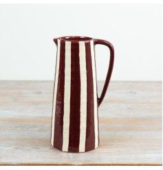 A versatile carafe, utensil holder or striking vase for dried flowers