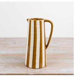 A tall mustard jug vase with distinctive stripes and rustic charm