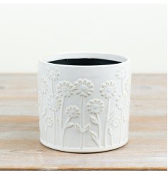 Give your plants a beautiful home with this embossed white planter 