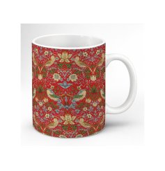 A striking crimson mug adorned with William Morris’s celebrated Strawberry Thief design